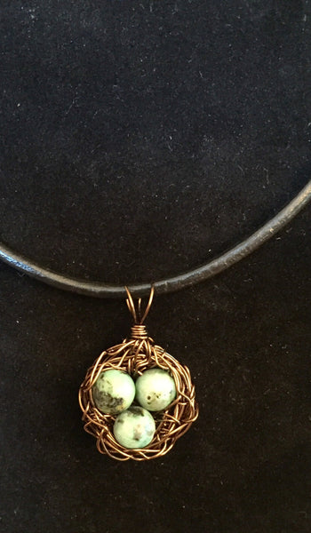 Necklace, birds nest pendant, bronze antique wire, three Turquoise eggs, handmade, on simple leather necklace