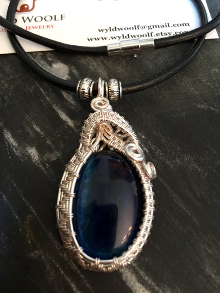 Necklace, brilliant blue Tiger's Eye pendant,hand wrapped in sliver plated copper, handmade, on simple leather necklace