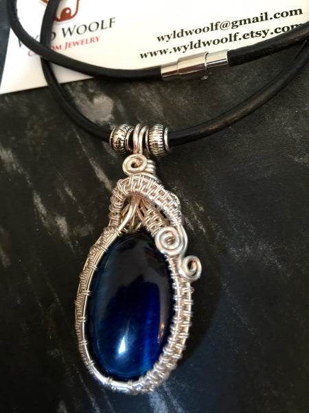 Necklace, brilliant blue Tiger's Eye pendant,hand wrapped in sliver plated copper, handmade, on simple leather necklace