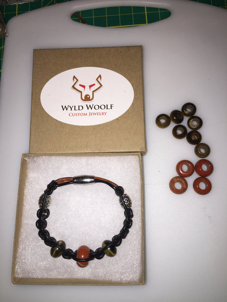 Black and brown knotted leather bracelet with Tiger's Eye and Red Jasper gemstone beads.